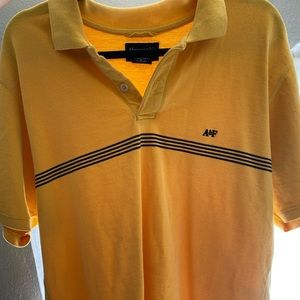 Abercrombie and Fitch yellow shirt. :)